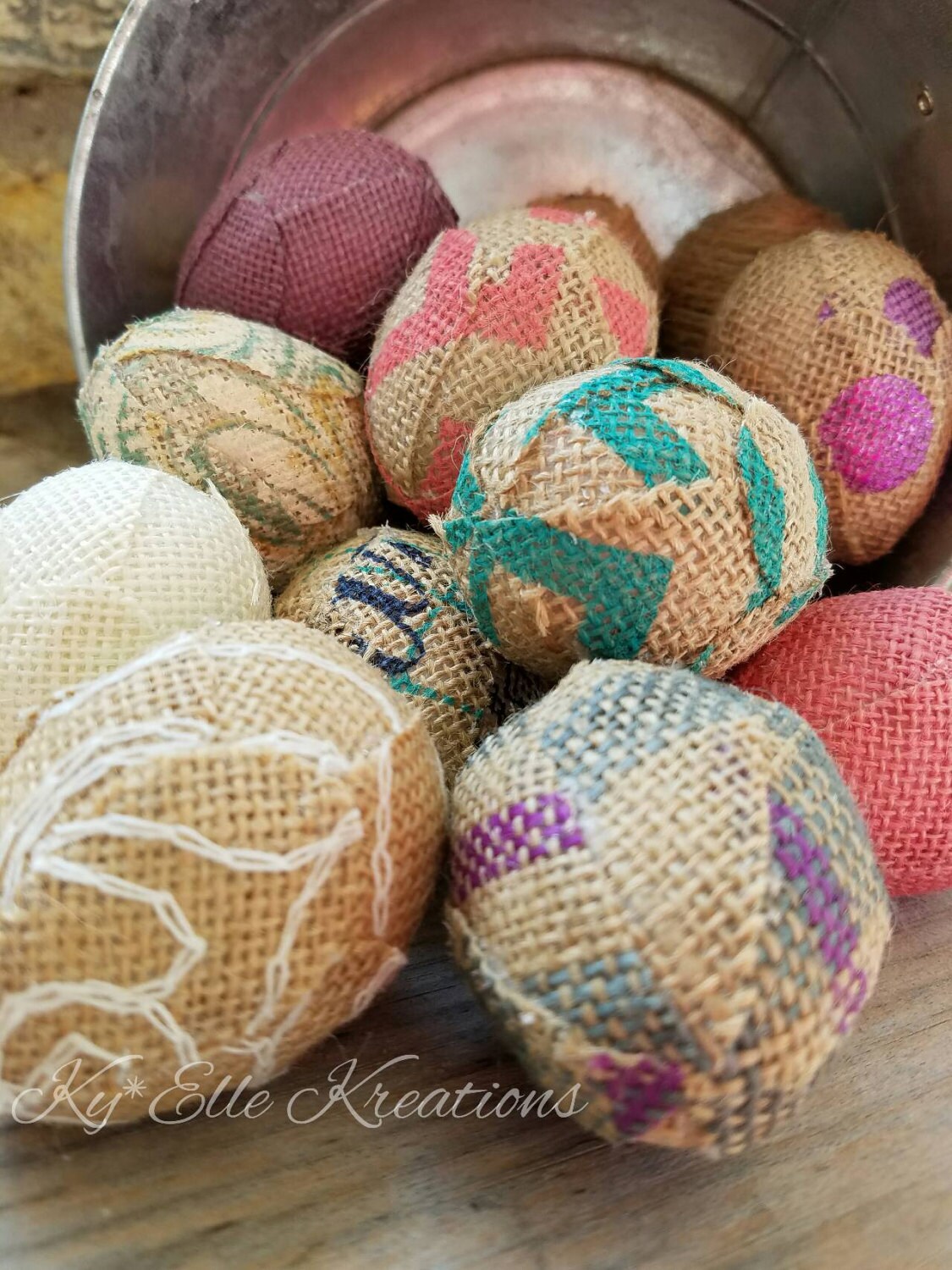 Handmade Burlap Easter Eggs in pastel colors, pinks, purples, aqua, tan and creams. Displayed in tin bucket.