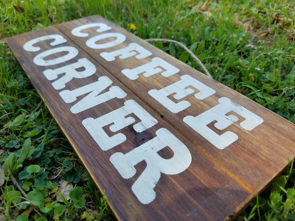 Wood Coffee Corner sign measuring 12x5 inch, close up of distressing in painted words.