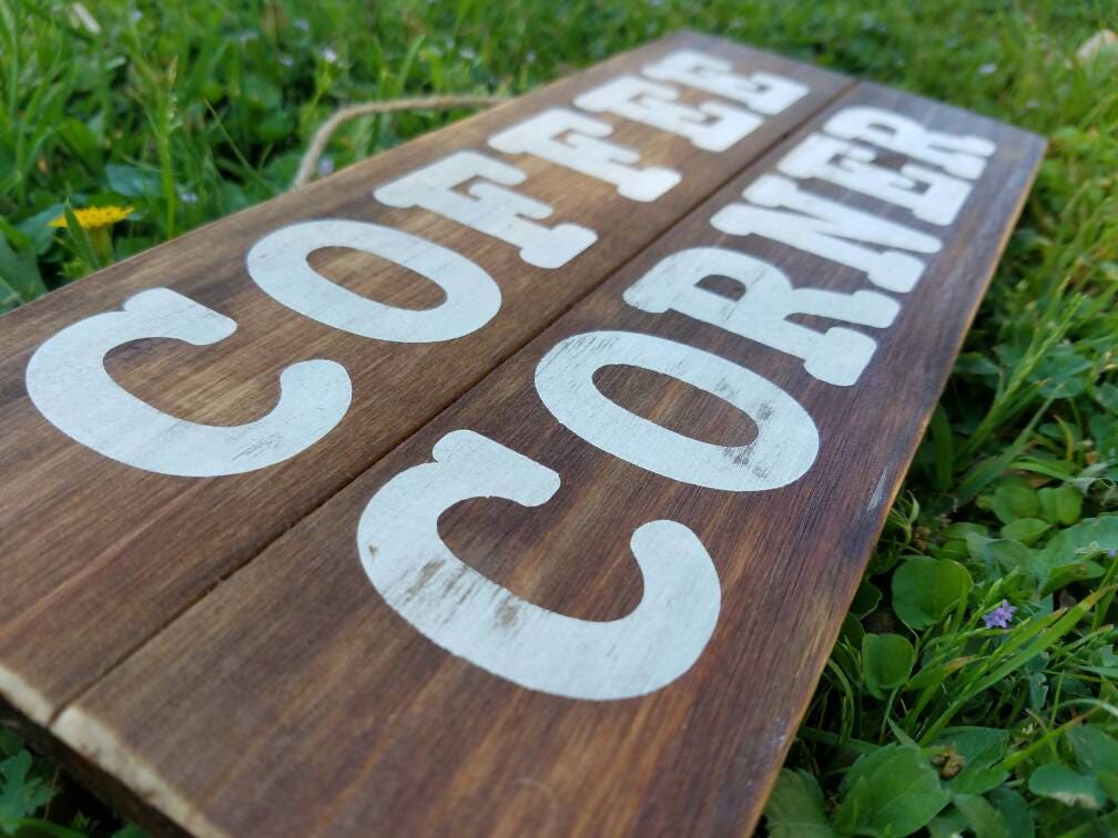 Wood Coffee Corner sign measuring 12x5 inch, close up of distressing in painted words.