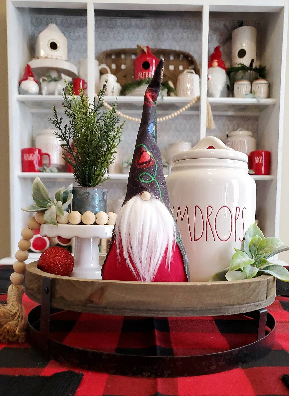 Christmas Light Gnome with white beard & red body. This handmade KyElle Kreations gnome measures 9 inches.. Displayed with faux foliage and seasonal accent decor.