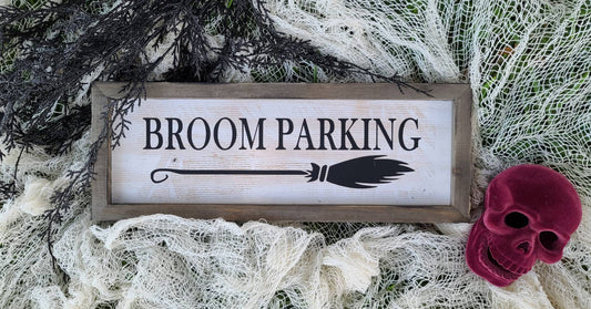 Broom Parking sign measuring 15x5.5 inches. White based sign with black print, outer frame in natural wood with slight distressing to give aged appearance.