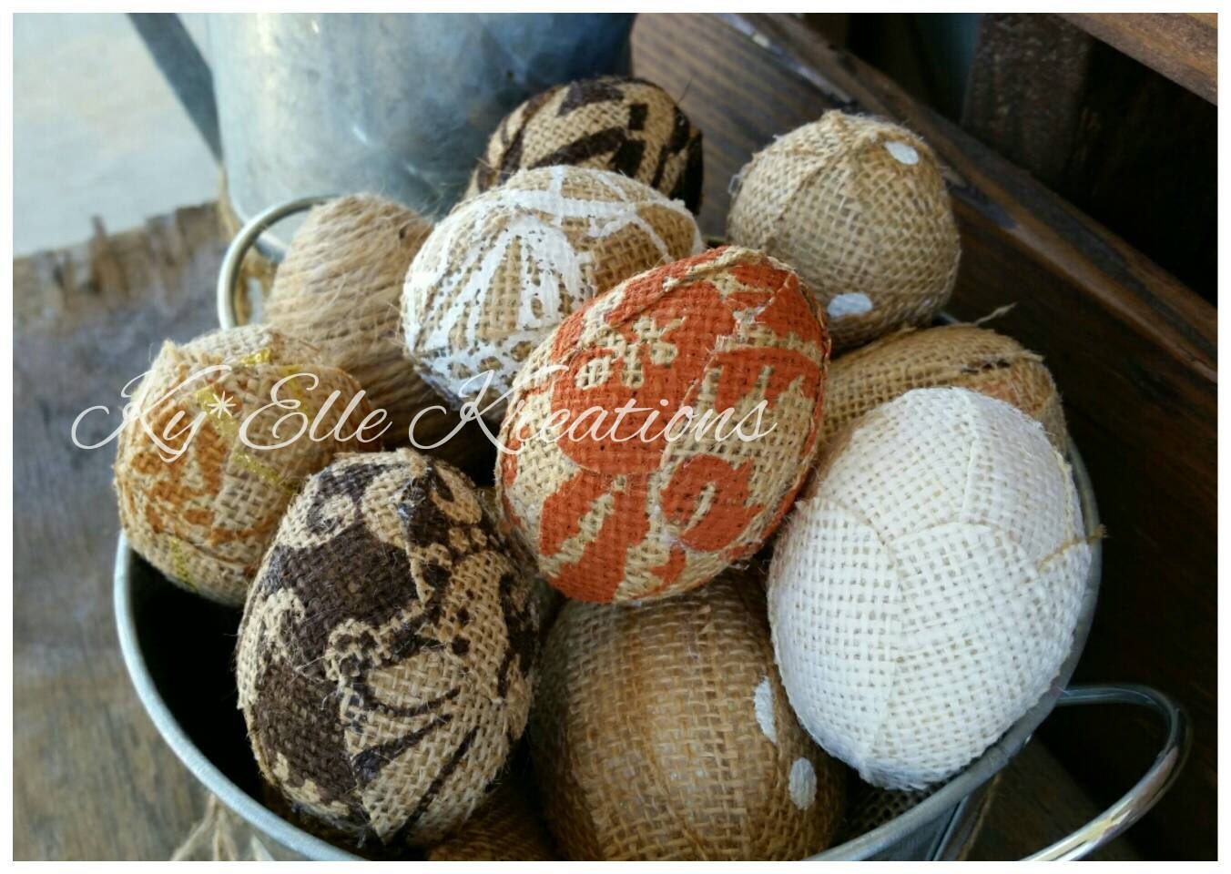 Handmade Burlap Easter Eggs in modern colors, burnt orange, chocolate, tan and creams. Displayed in tin bucket.