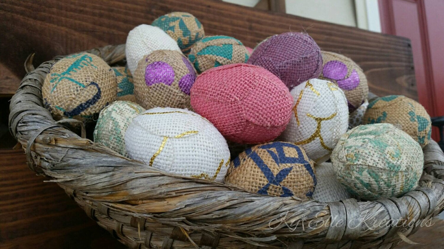 Handmade Burlap Easter Eggs in Easter pastel colors, pink, purple, aqua, gold, tan and creams. Displayed in hand woven basket.