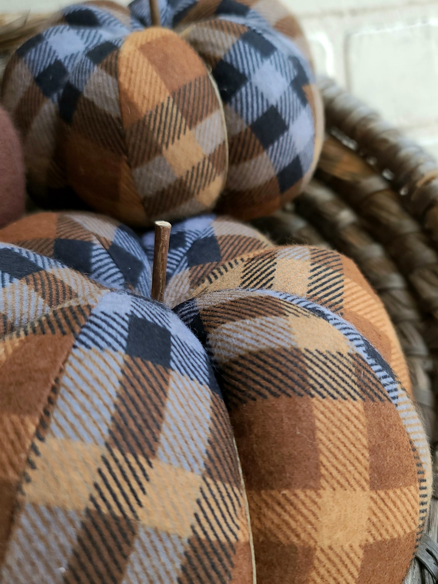 close up of  chocolate plaid with brown, tan, black & gray hues.