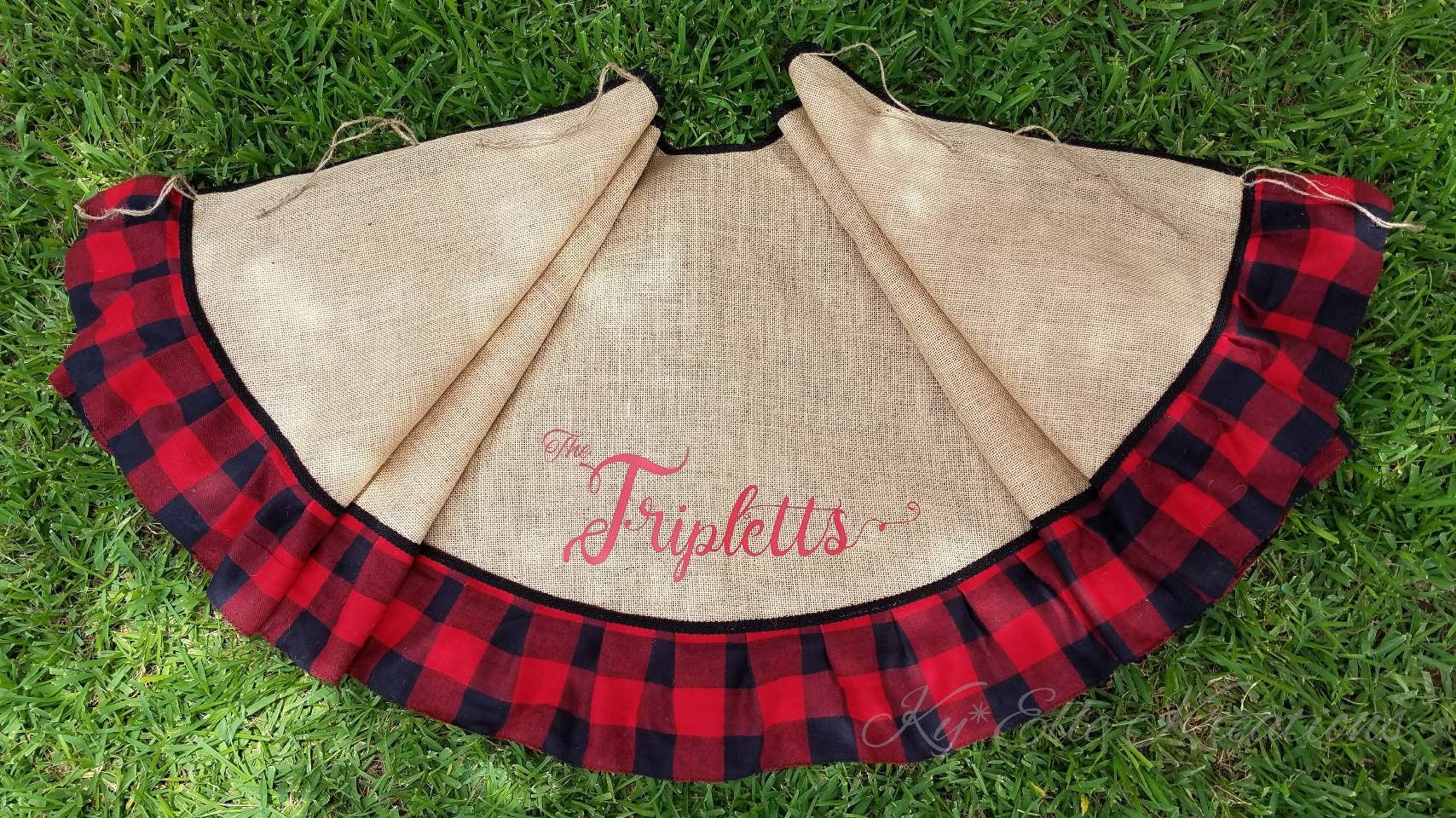 Red & Black Buffalo Plaid, Burlap Christmas Tree Skirt displayed with personalized family name, The Triplets in red,