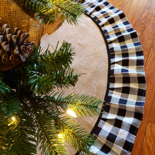 White & Black Buffalo Plaid, Burlap Christmas Tree Skirt displayed below a decorated Holiday Tree.