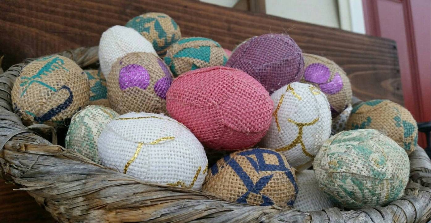 Handmade Burlap Easter Eggs in Easter pastel colors, pink, purple, aqua, gold, tan and creams. Displayed in hand woven basket.