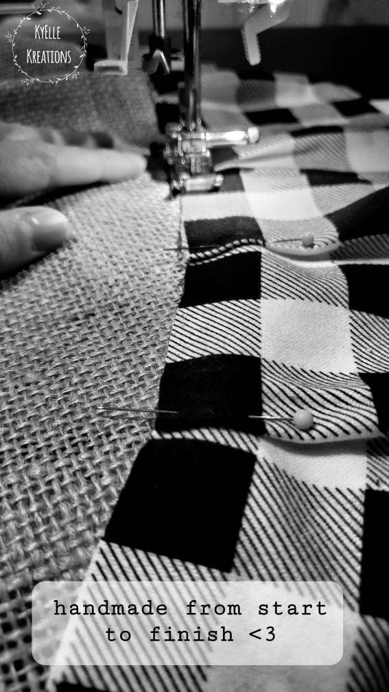 black and white image showcasing hand pinned christmas tree skirt, being sewn.