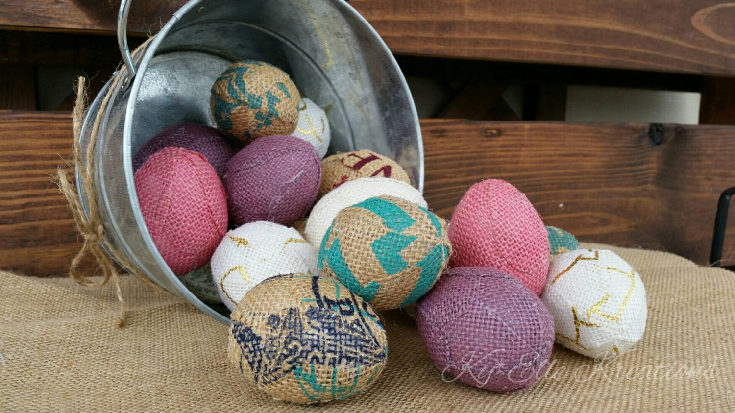 Handmade Burlap Easter Eggs in pastel colors, pinks, purples, aqua, tan and creams. Displayed in tin bucket.